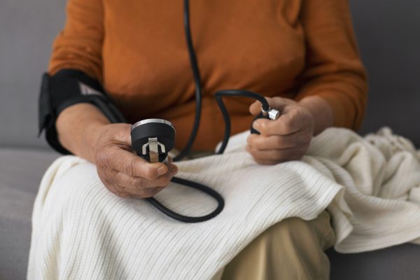 older-person-checking-their-blood-pressure-with-tensiometer